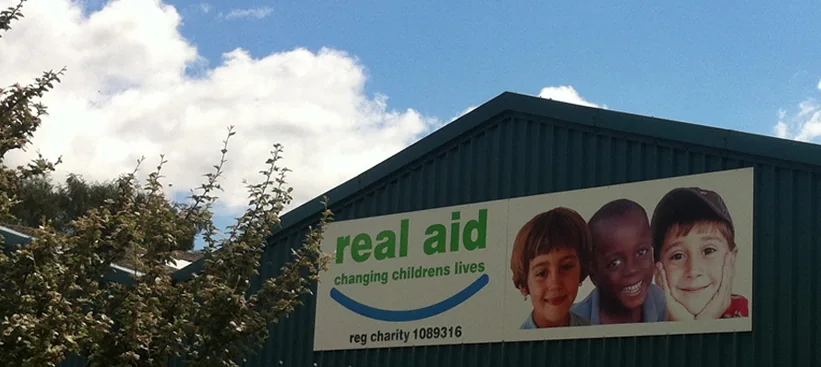 The Real Aid warehouse at Tickton, with the charity's sign on the gable end